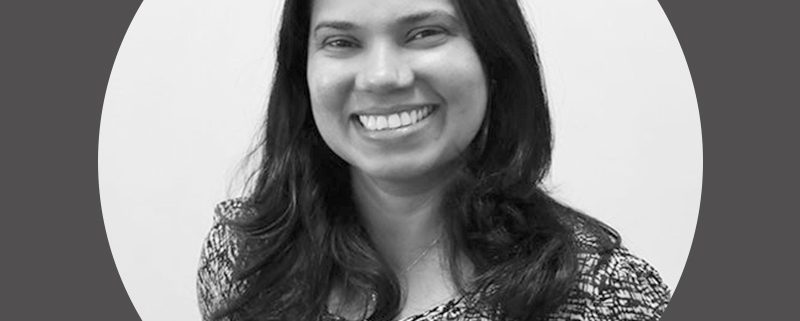 Black and white photo of Dr Radika Karunarathne consultant radiologist