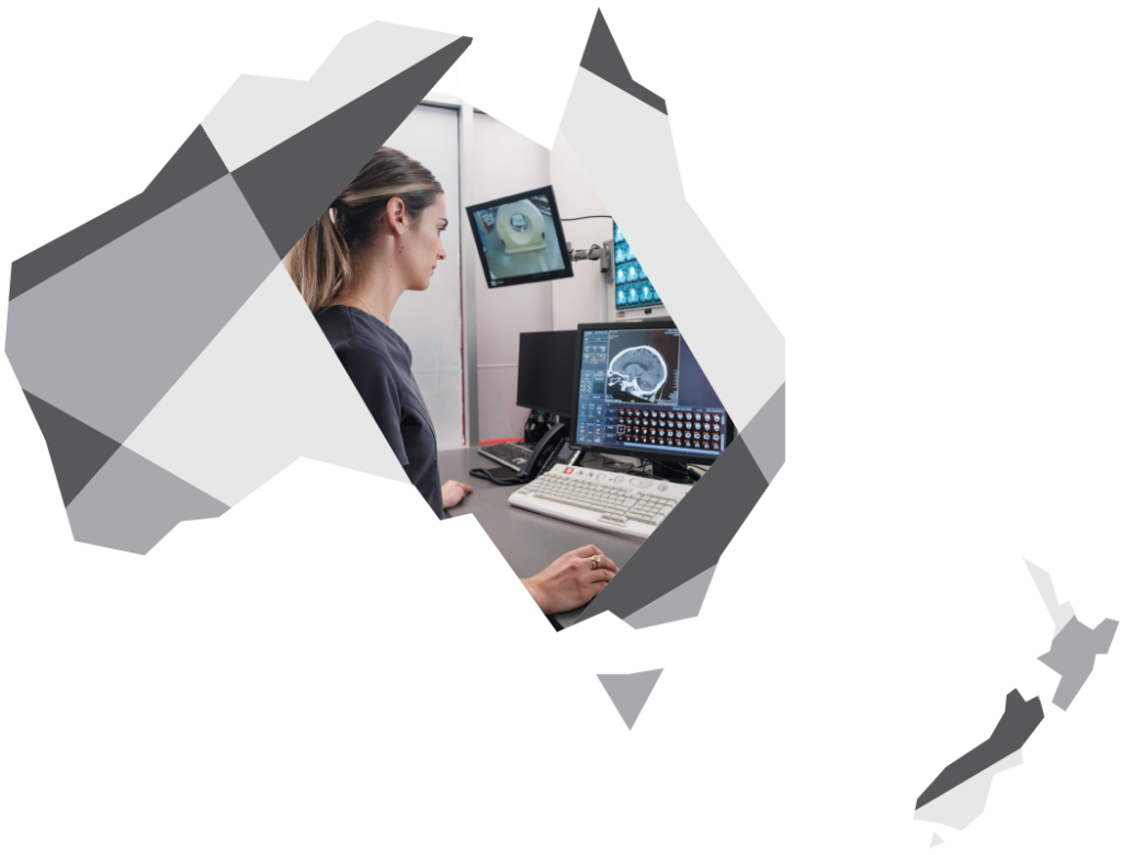 A graphic featuring a geometric, multi-shaded gray map outline of Australia and New Zealand, with the main map of Australia revealing a female radiologist looking at a brain MRI scan on a computer monitor.